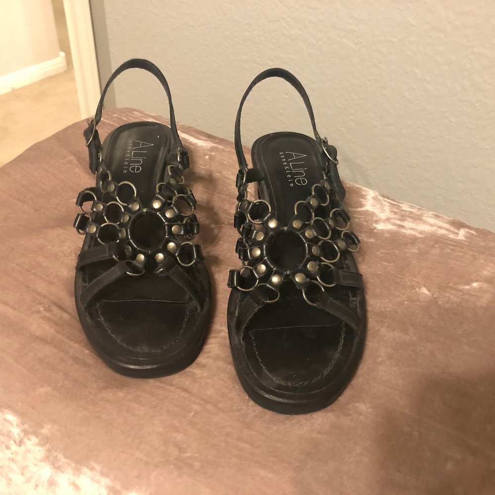 Black leather and metal sandals